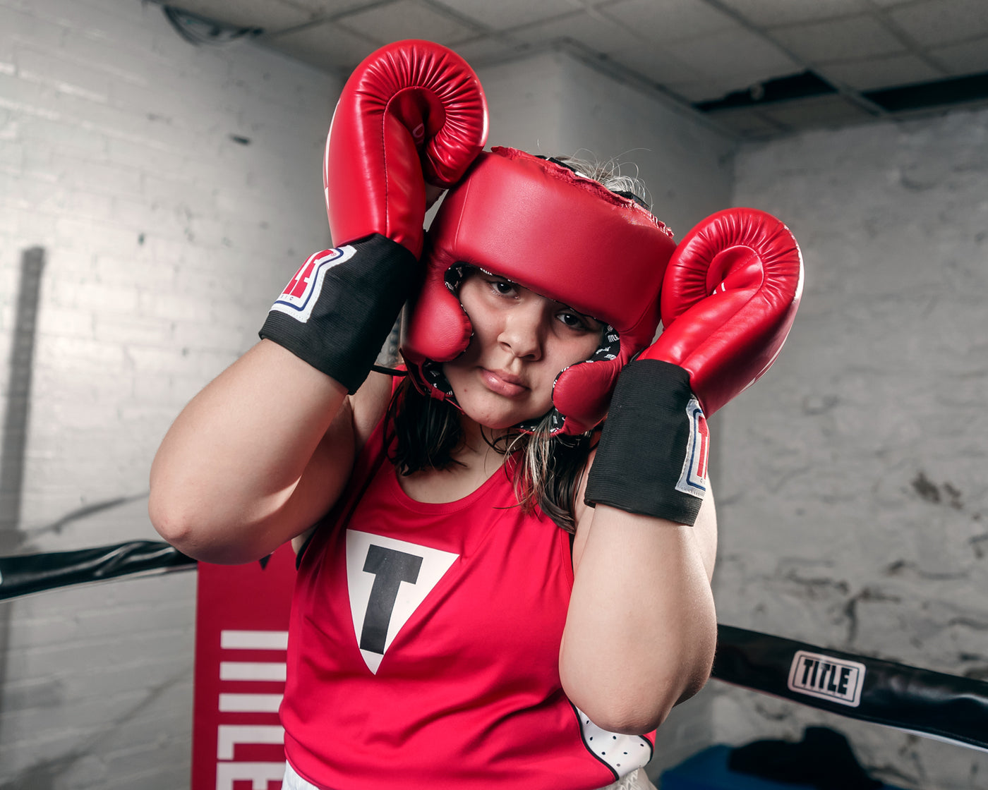 variant:Blank Red::TITLE Boxing USA Boxing Competition Headgear - With Cheeks girl hands on head