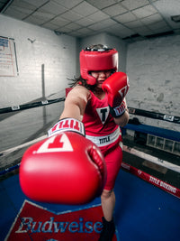 variant:Blank Red::TITLE Boxing USA Boxing Competition Headgear - With Cheeks girl right punch