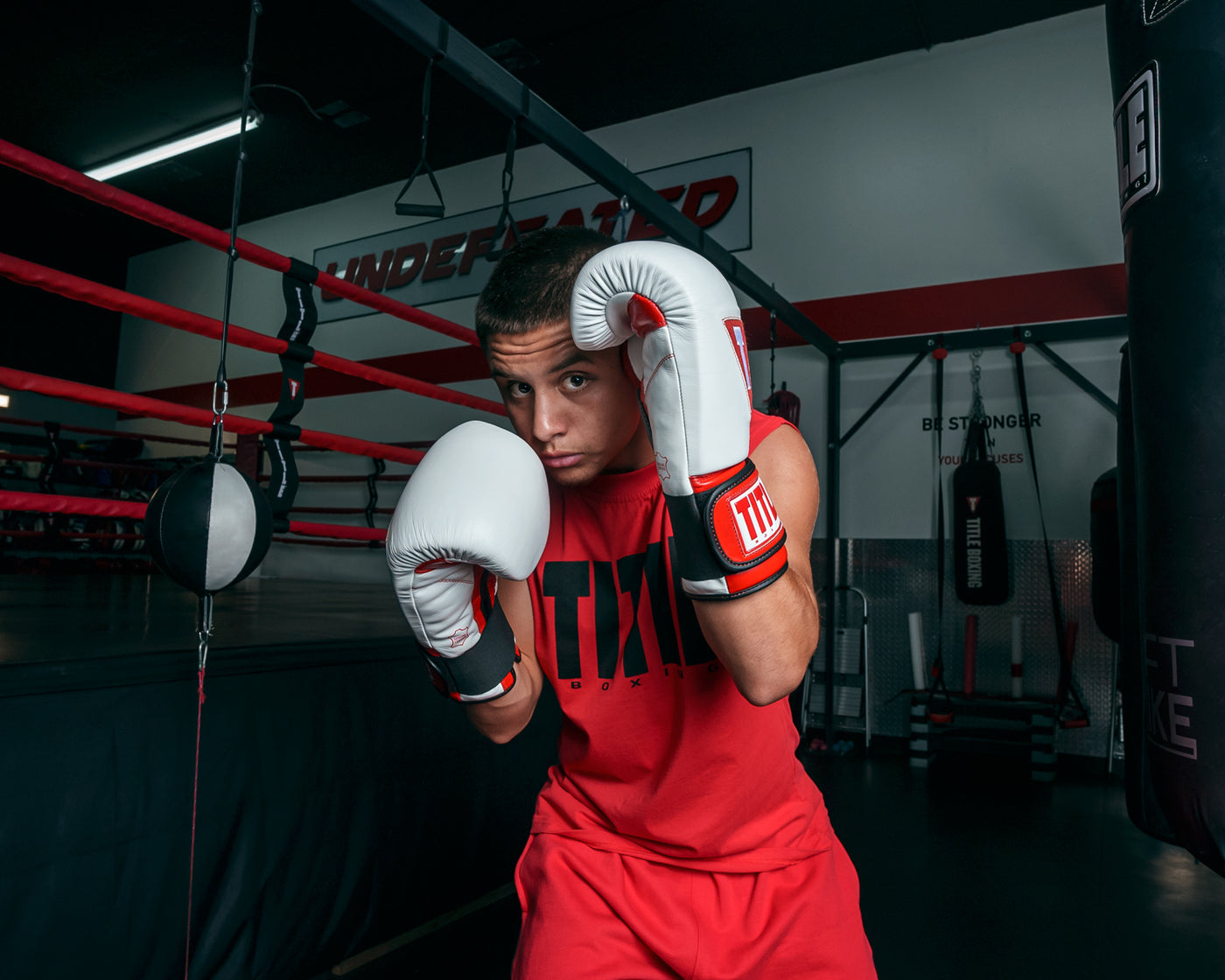 variant:red/white::TITLE Boxing All Heart Bag Gloves 2.0 guy boxing stance