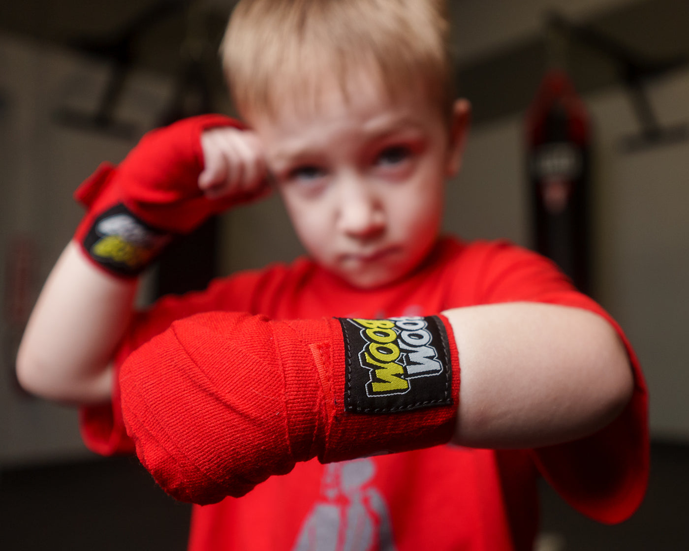 variant:red::BOOM BOOM Boxing Youth Flex Hand Wraps kid close up of one handwrap