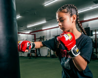 variant:Red/Black/White:: BOOM BOOM Boxing Bomber Youth MMA Gloves girl hitting bag
