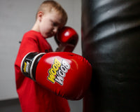 variant:Red/Black::BOOM BOOM Boxing Striker Youth Boxing Gloves boy hitting bag close up on glove