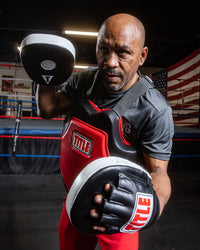 variant:lifestyle::TITLE Classic Boxing Coach Bundle in uses on a boxing coach