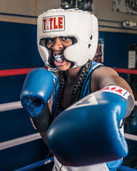 variant:white::TITLE Classic USA Boxing Competition Headgear-With Cheeks guy in ring showing mouthguard