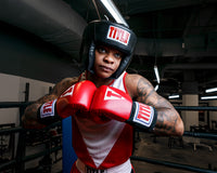 variant:black::TITLE Classic USA Boxing Competition Headgear – Open Face kid in ring hands together