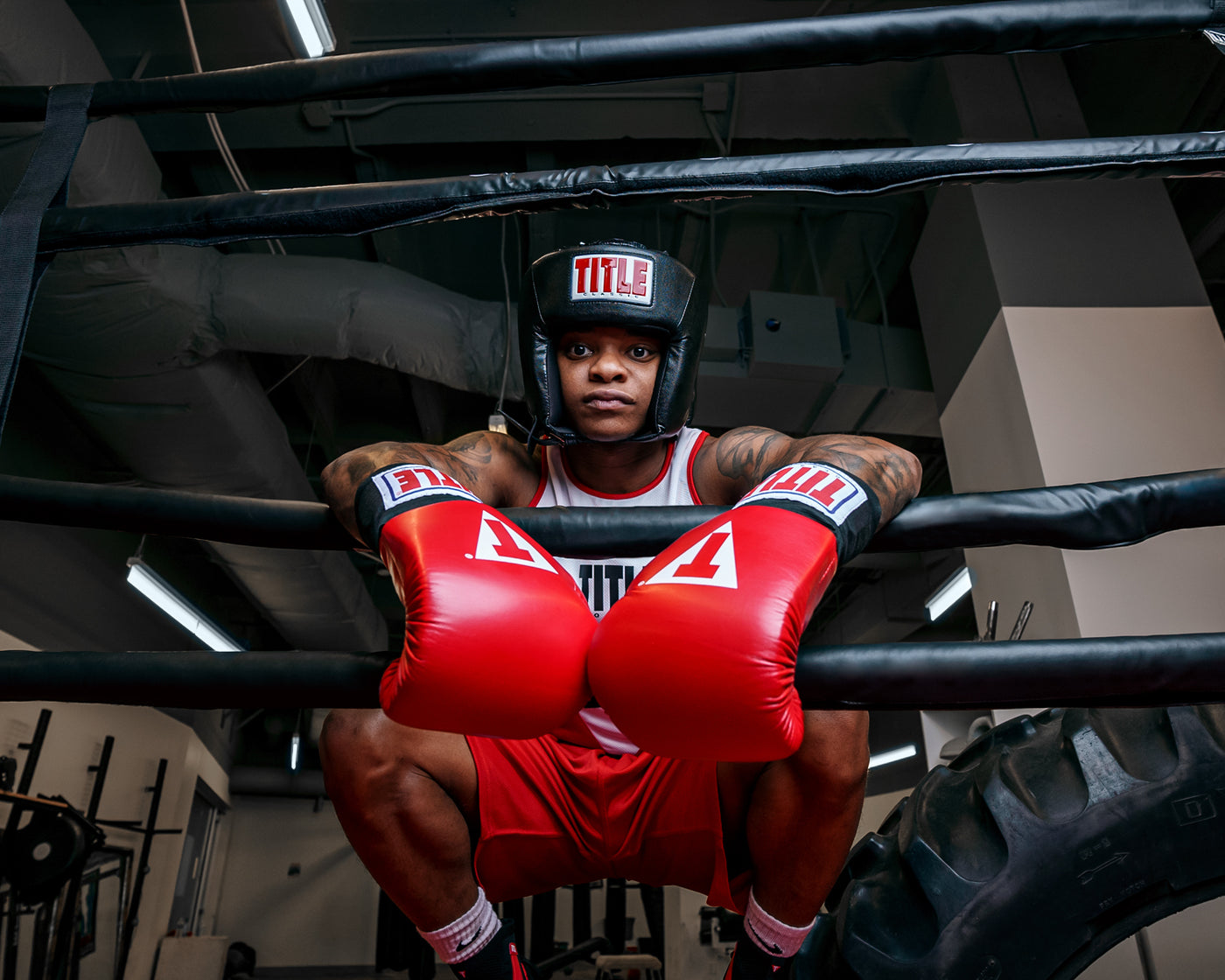 variant:black::TITLE Classic USA Boxing Competition Headgear – Open Face kid hanging on ropes