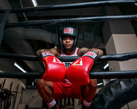 variant:black::TITLE Classic USA Boxing Competition Headgear – Open Face kid hanging on ropes