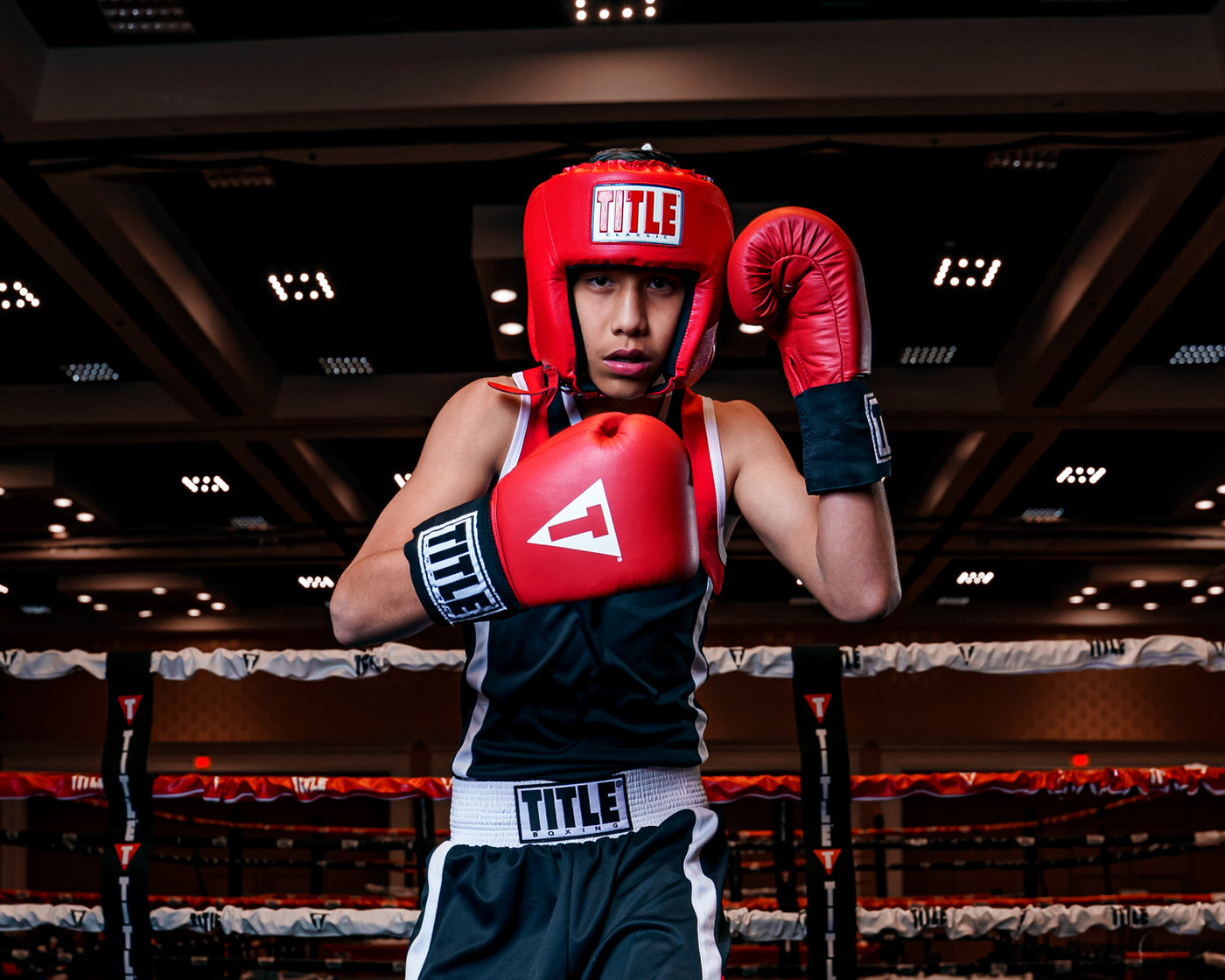 variant:red::TITLE Classic USA Boxing Competition Headgear-Open Face kid in ring with black outfit