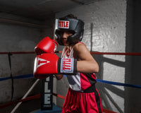 variant:black::TITLE Classic USA Boxing Competition Headgear- With Cheeks kid in ring