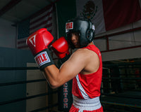 variant:black::TITLE Classic USA Boxing Competition Headgear- With Cheeks  kid in ring boxing stance