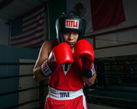 variant:black::TITLE Classic USA Boxing Competition Headgear- With Cheeks kid in ring hands up boxing pose
