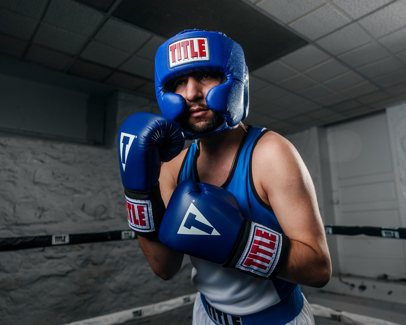 variant:blue::TITLE Classic USA Boxing Competition Headgear – With Cheeks in ring boxing pose