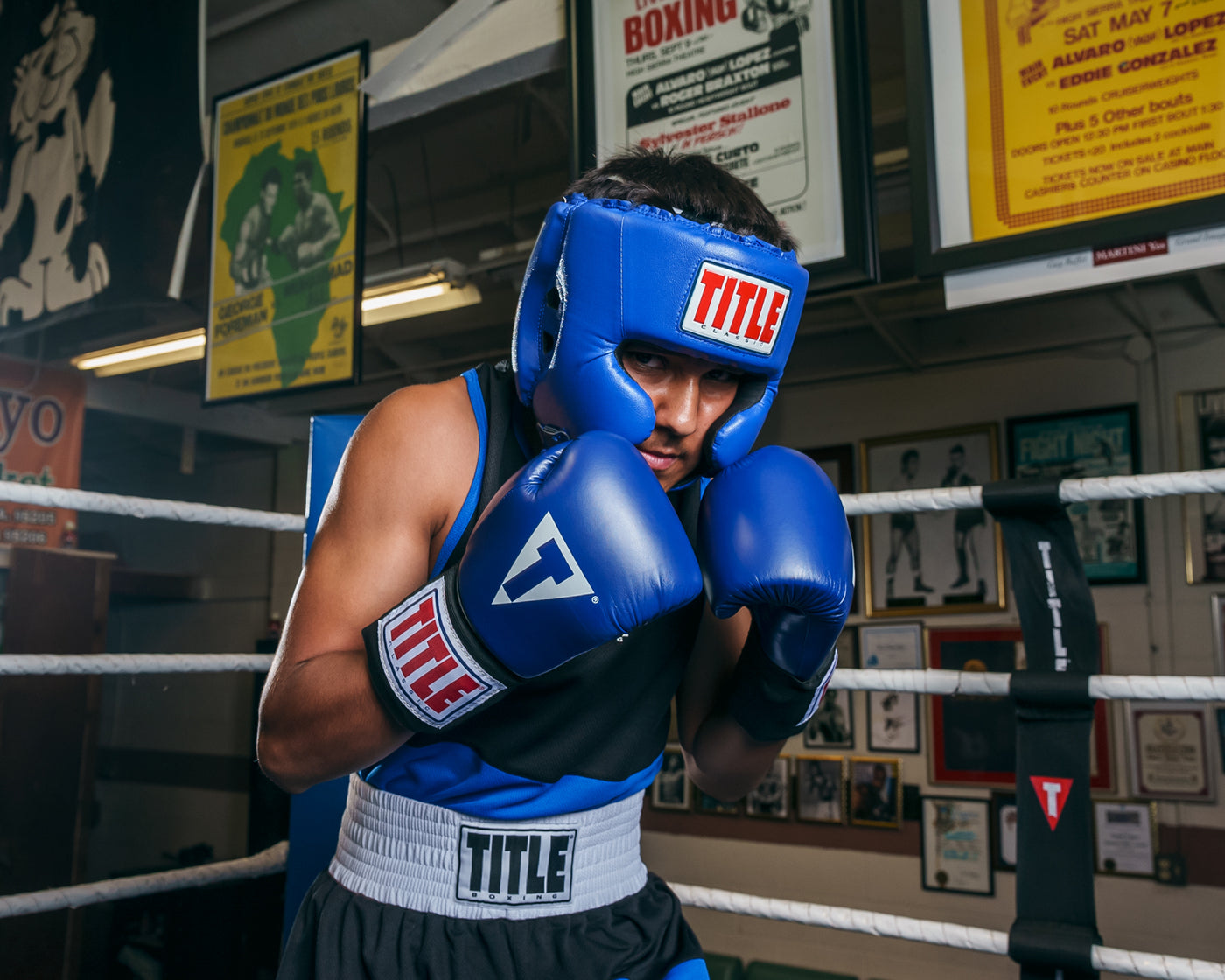 variant:blue::TITLE Classic USA Boxing Competition Headgear – With Cheeks guy in ring boxing stance
