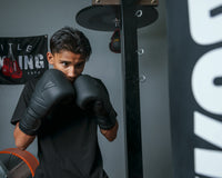 variant:black::TITLE Black Bolstered Leather Bag Gloves guy shadow boxing