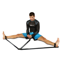 variant:lifestyle::TITLE Boxing Deluxe Leg Stretch guy using leg stretch equipment