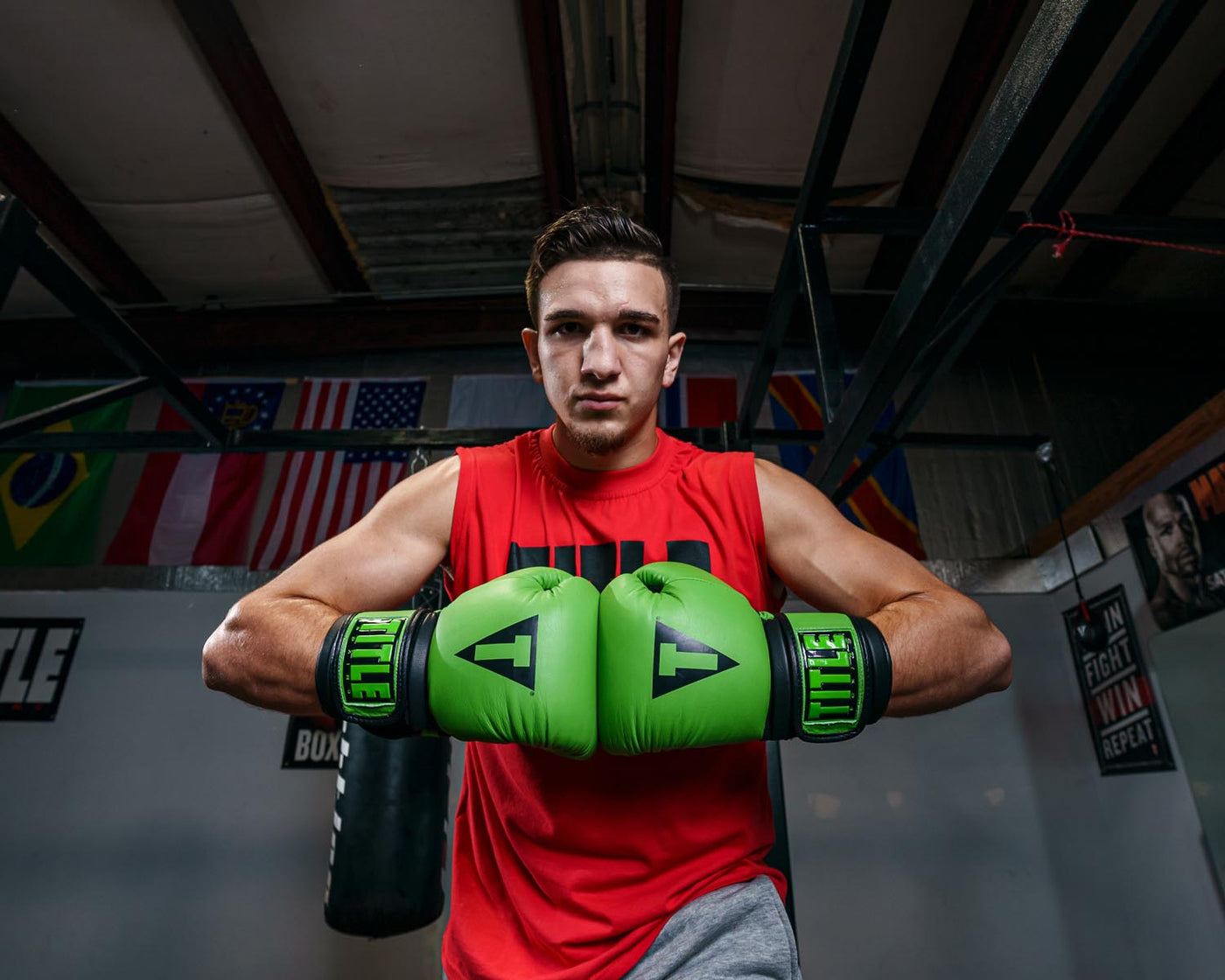 variant:green/black::TITLE Boxing Dauntless Training Gloves guy hands together