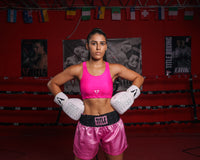 variant:pink::TITLE Boxing Pro Compression Ascent Sports Bra girl with hands on her hips
