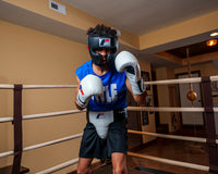 variant:black::Fighting Leather Sparring Headgear guy in ring with headgear
