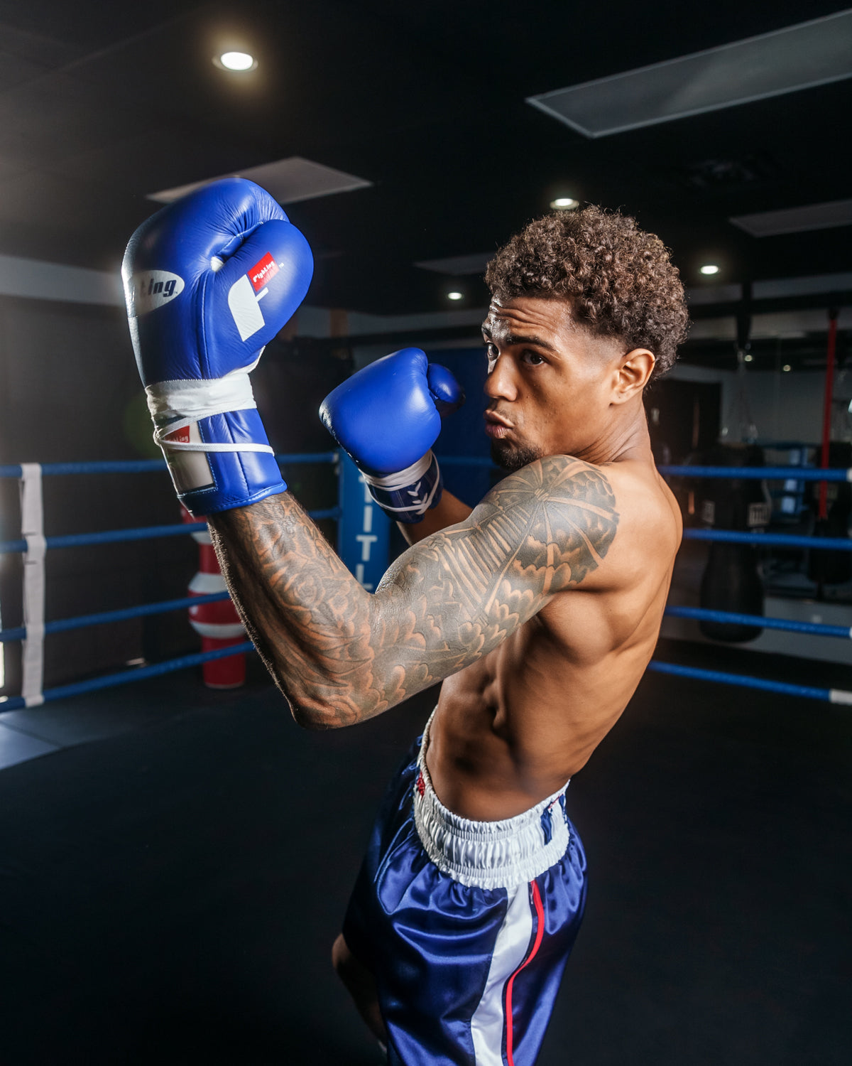 variant:Blue::Fighting Fearless Certified Pro Fight Gloves II man posing in gloves