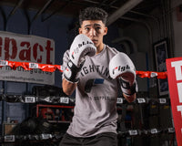 variant:White/Black::Fighting S2 GEL Power Sparring Gloves boy posing in gloves in ring