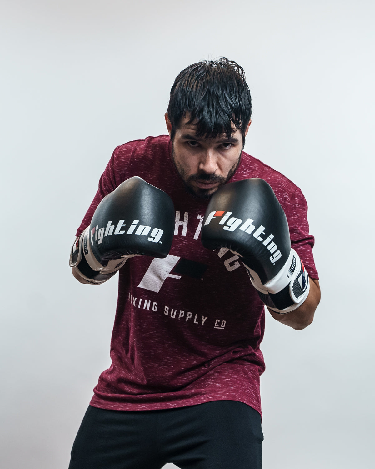 variant:Black/White::Fighting S2 GEL Power Sparring Gloves man posing in gloves