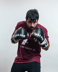 variant:Black/White::Fighting S2 GEL Power Sparring Gloves man posing in gloves