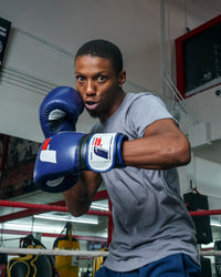 variant:blue/white::Fighting Force Training Gloves guy posing with gloves