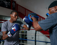 variant:blue/white::Fighting Force Training Gloves guy posing with gloves
