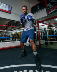 variant:blue/white::Fighting Force Training Gloves guy posing with gloves