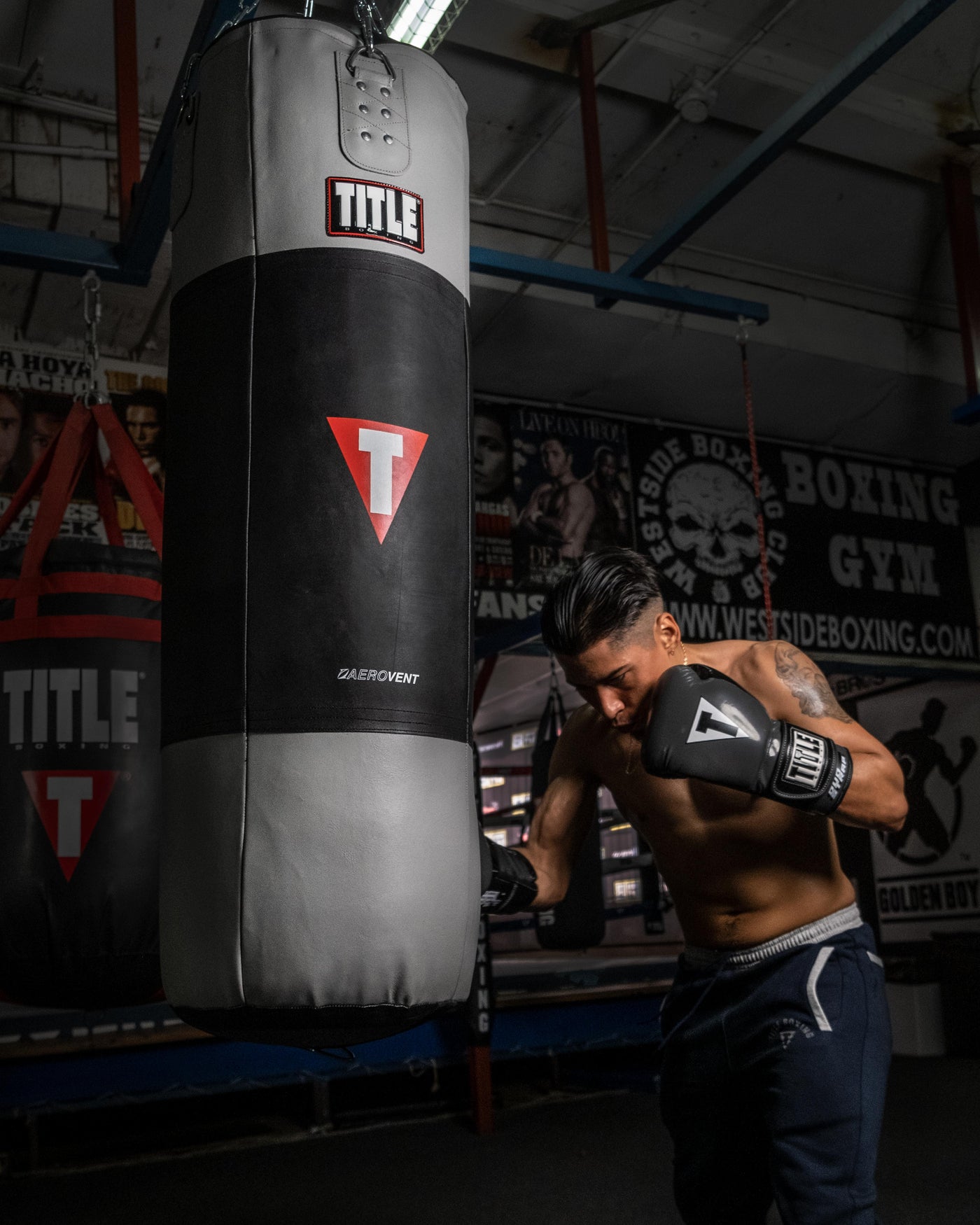 variant:Grey/Black::TITLE Boxing Gel Glory Super Bag Gloves 2.0 man striking bag