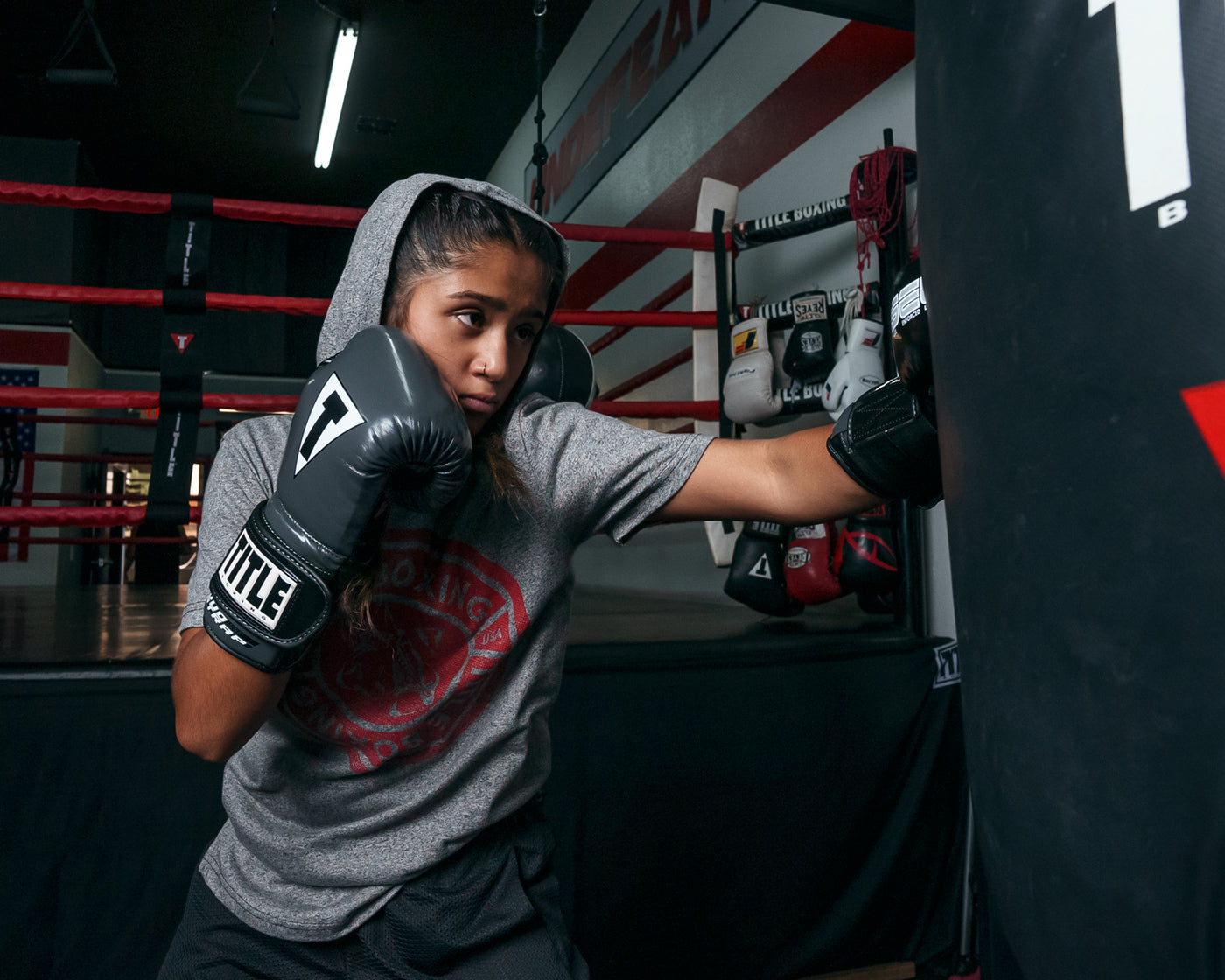 variant:Grey/Black::TITLE Boxing Gel Glory Super Bag Gloves 2.0 girl striking bag