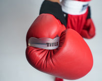 variant:clear/black::TITLE Boxing Gel Max Channel Mouth Guard 2.0 mouth guard in glove