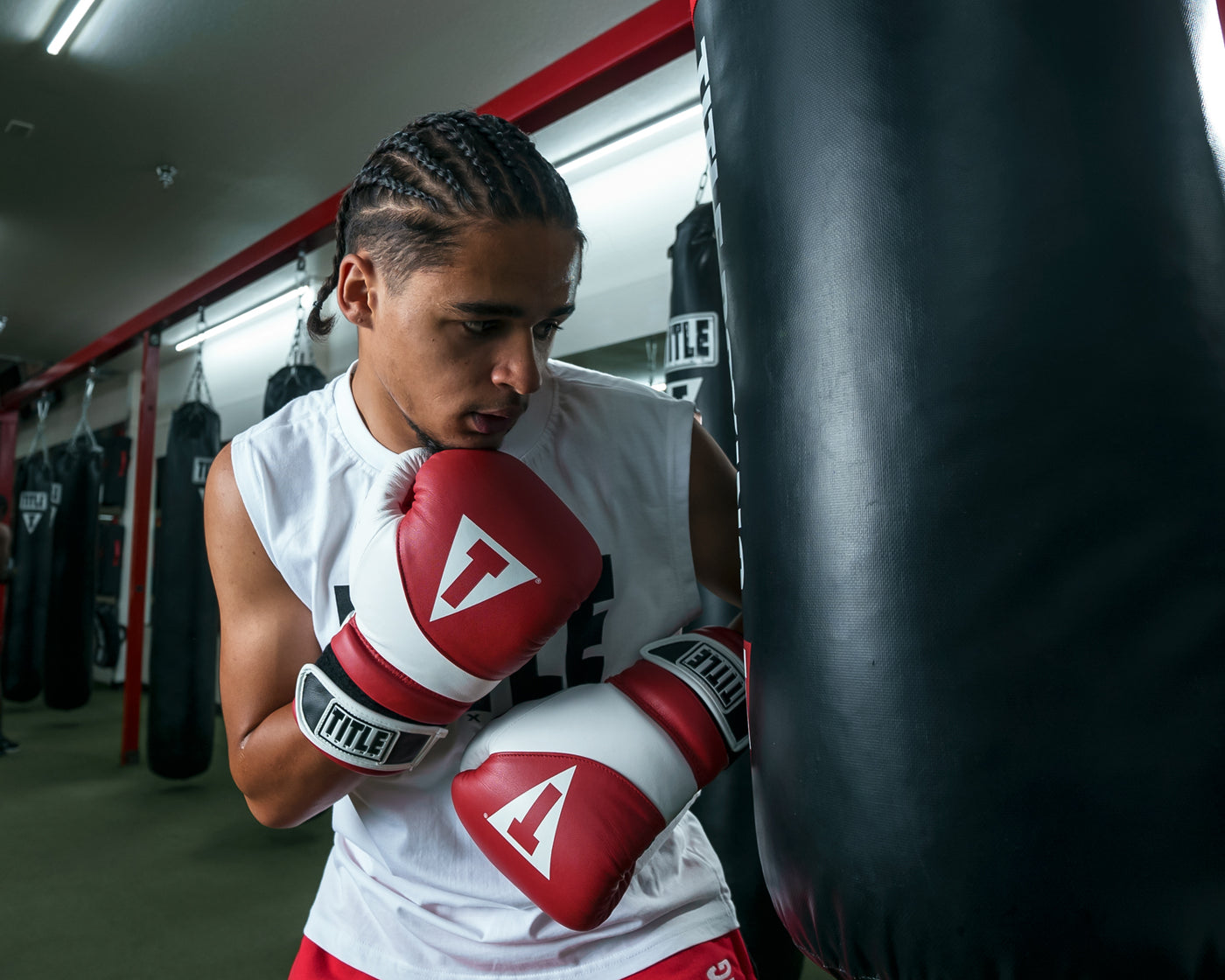 variant:Red/White::TITLE Boxing Gel Suspense Training Gloves man striking bag