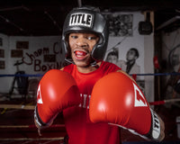 variant:Red/Black::TITLE Boxing Gel Triple-Shox Mouth Guard 2.0 man posing with mouth guard
