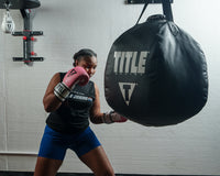 variant:Pink/White::TITLE Boxing Gel World Bag Gloves woman striking bag