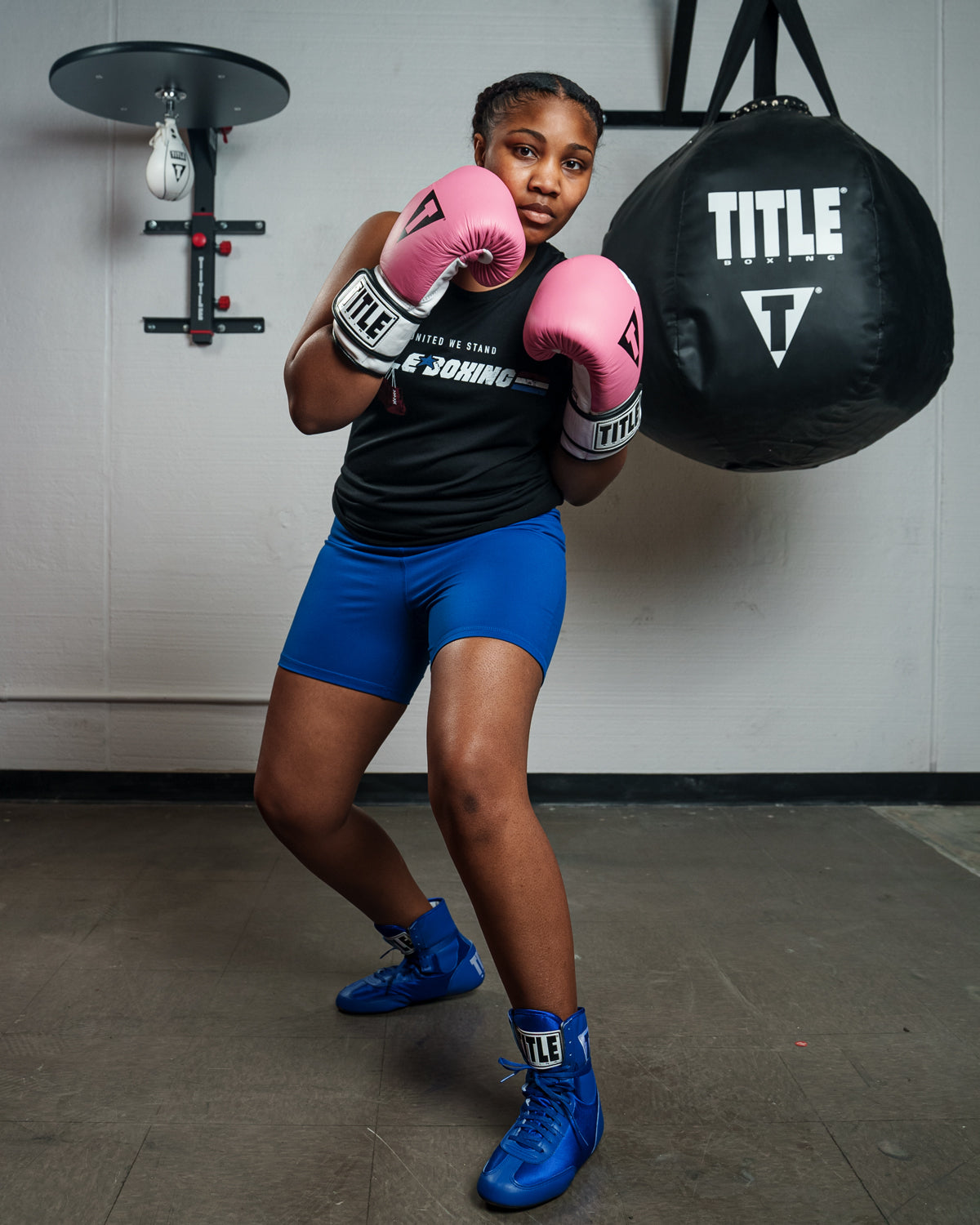 variant:Pink/White::TITLE Boxing Gel World Bag Gloves woman posing with gloves
