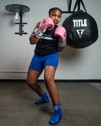 variant:Pink/White::TITLE Boxing Gel World Bag Gloves woman posing with gloves