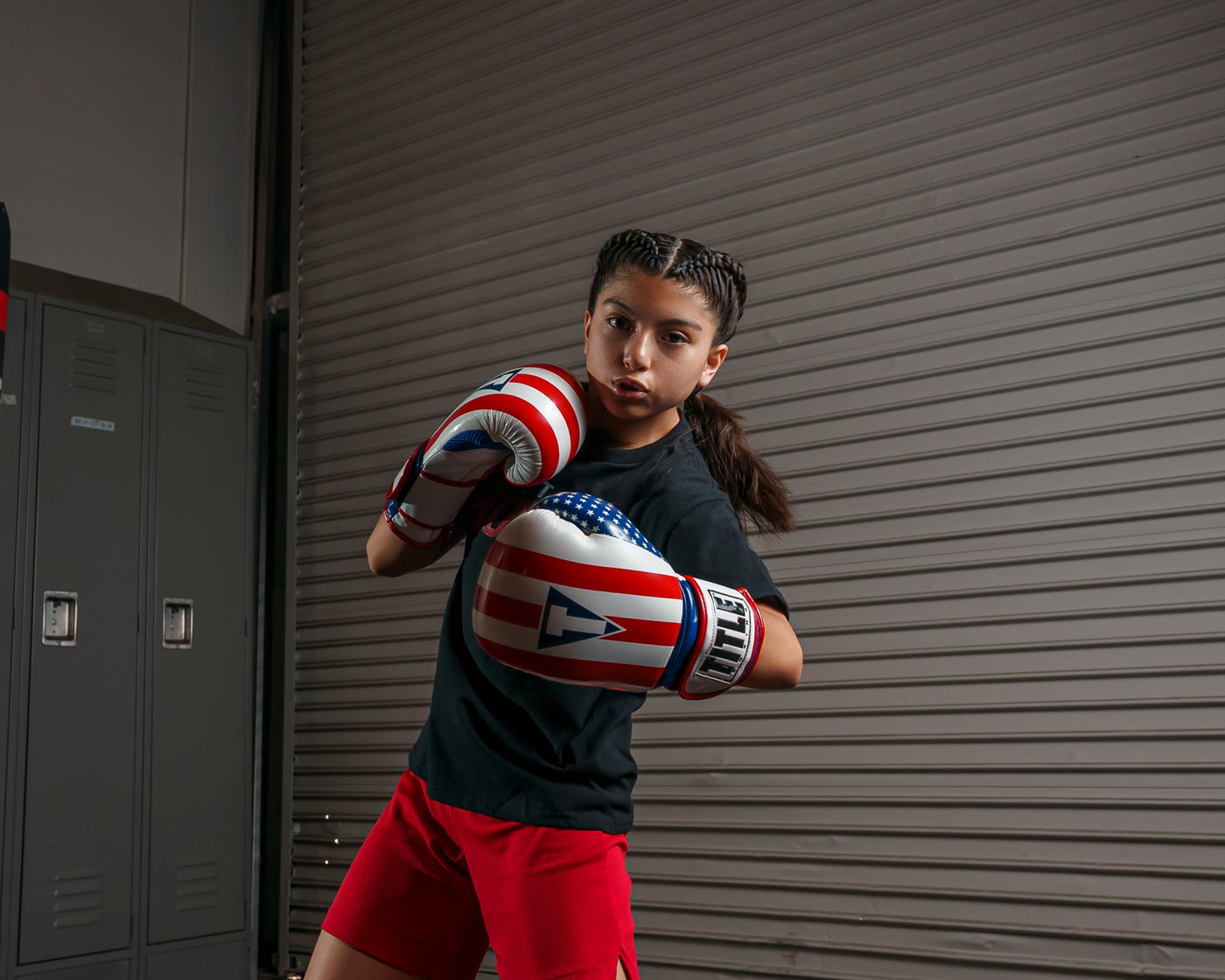 variant:lifestyle::TITLE Boxing Infused Foam Combat USA Training Gloves girl posing with boxing gloves
