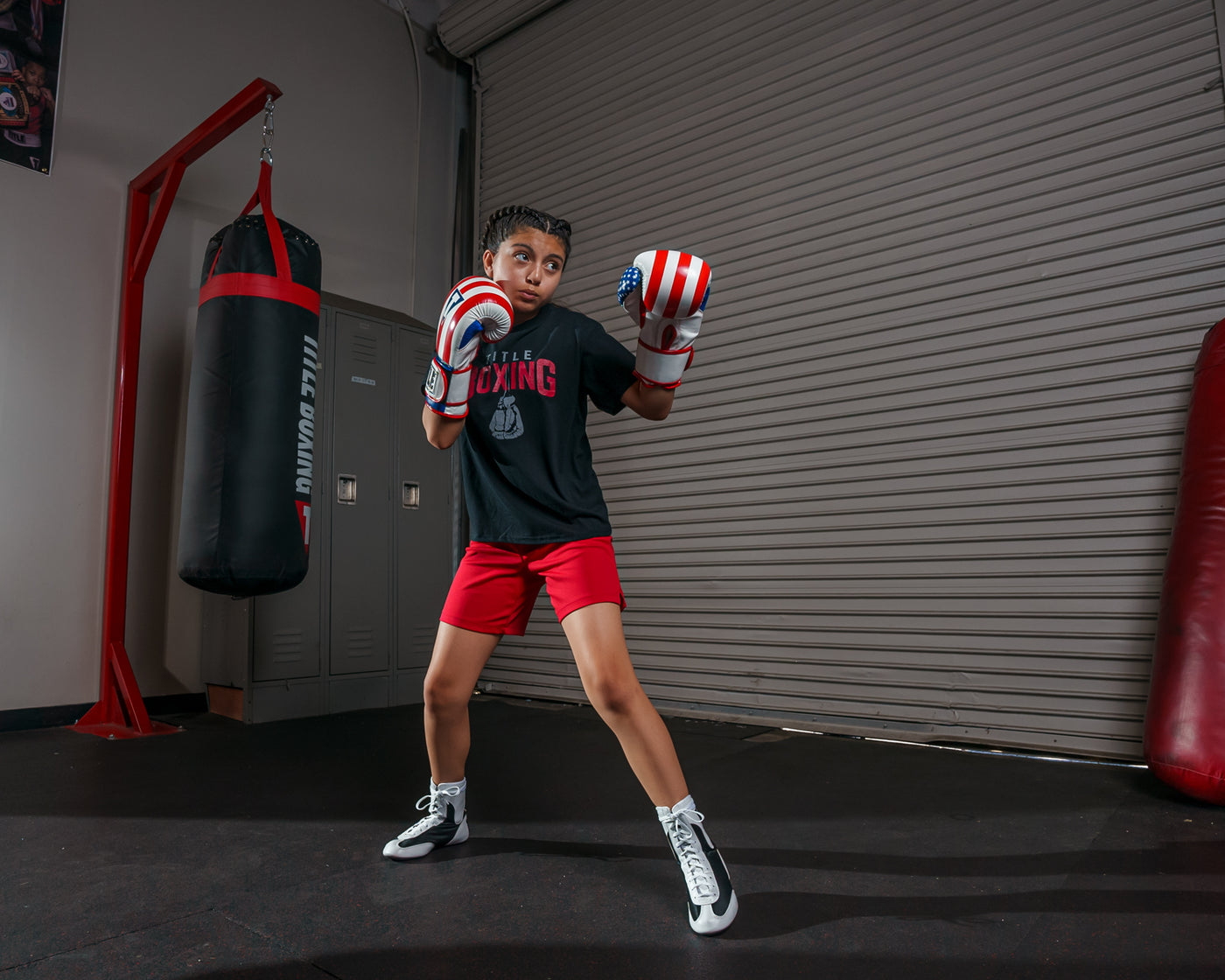 variant:lifestyle::TITLE Boxing Infused Foam Combat USA Training Gloves girl posing with boxing gloves