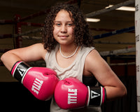 variant:pink/black::TITLE Boxing Instinct Fitness Bag Gloves girl posing with boxing gloves