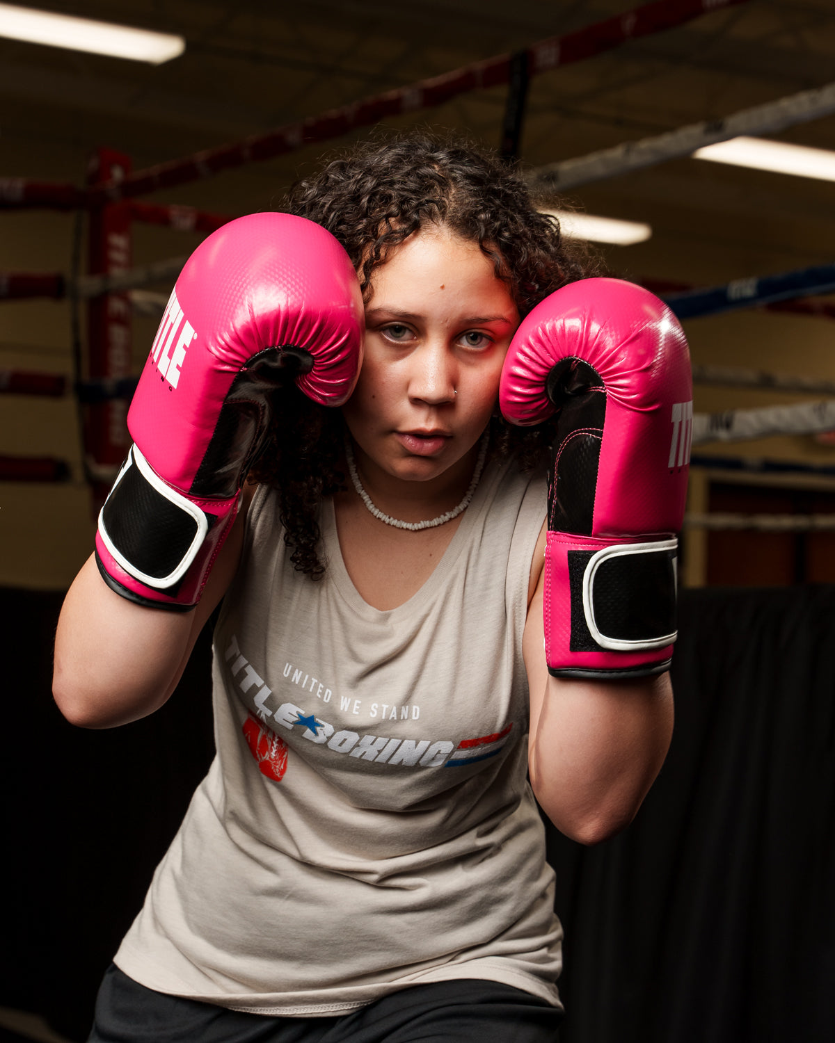 variant:pink/black::TITLE Boxing Instinct Fitness Bag Gloves girl posing with boxing gloves