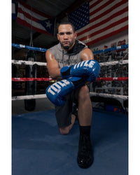 variant:Blue/White::TITLE Boxing Inferno Intensity Elastic Training Gloves man posing in gloves