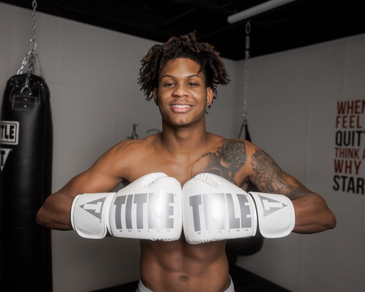 variant:White::TITLE Boxing Inferno Intensity Elastic Training Gloves man posing wearing gloves