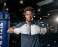 variant:white::TITLE Boxing Ko-Vert Bag Gloves guy posing with boxing gloves