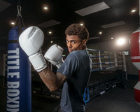 variant:white::TITLE Boxing Ko-Vert Bag Gloves guy posing wearing boxing gloves