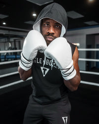 variant:White::TITLE Boxing Ko-Vert Sparring Gloves man posing in gloves