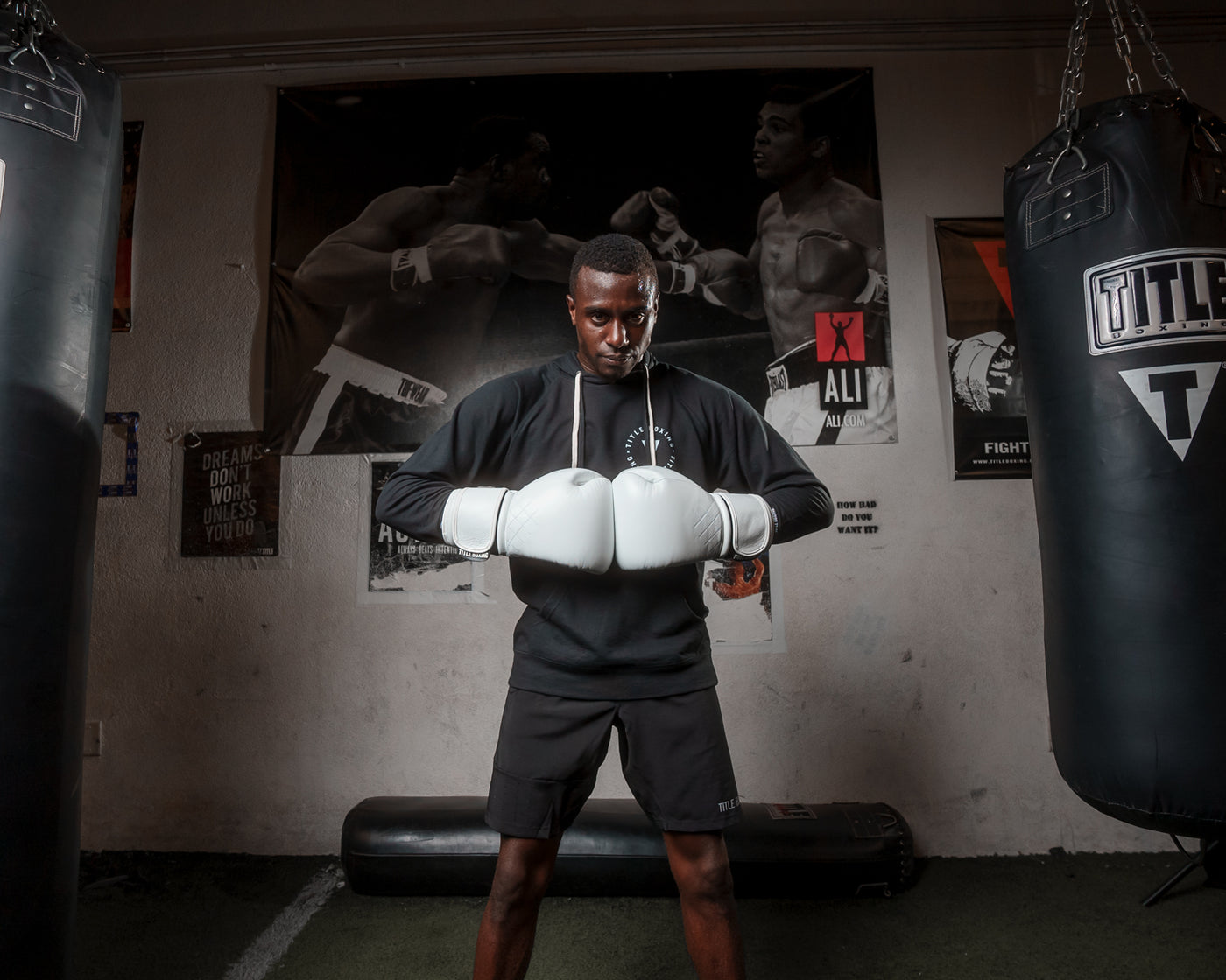 variant:White::TITLE Boxing Ko-Vert Training Gloves man wearing gloves in gym