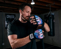 variant:black::TITLE Boxing Defender Sublimated Glove Wraps