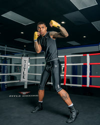 variant:Gold::TITLE Boxing Mexican Style 180" Hand Wraps guy posing with hands wrapped in hand wraps