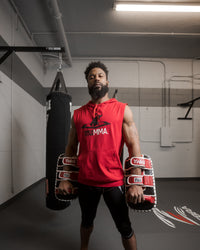 variant:red/white/black::TITLE MMA Air Raid Thai Pads (Pair) guy with hands down